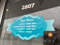 Exterior door lettering  Address in cut vinyl and store hours printed and cut to shape